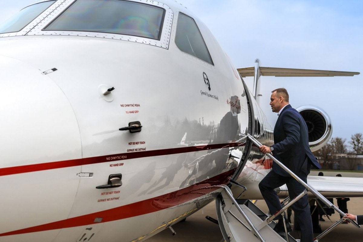 president signing documents airplane
