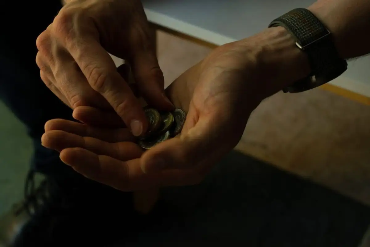 elderly woman counting coins