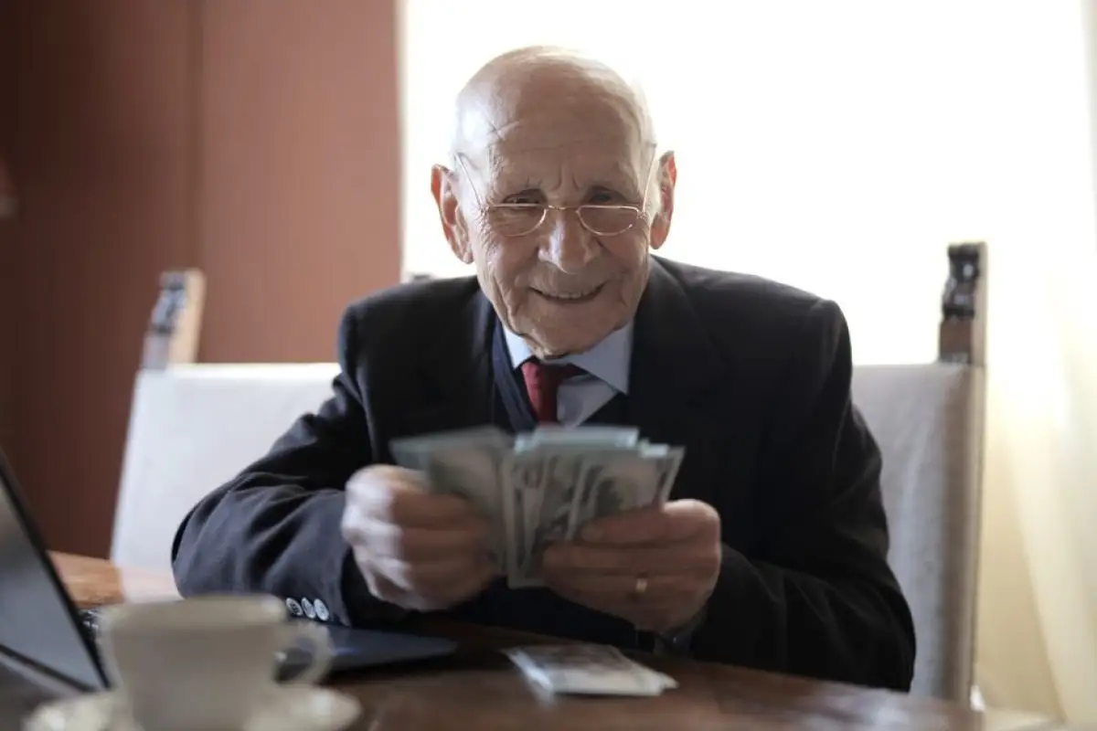 elderly person counting money